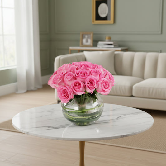 Bouquet of pink roses in a clear vase on a white background