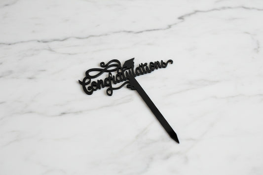 Black 'Congratulations' decorative pick on a white background